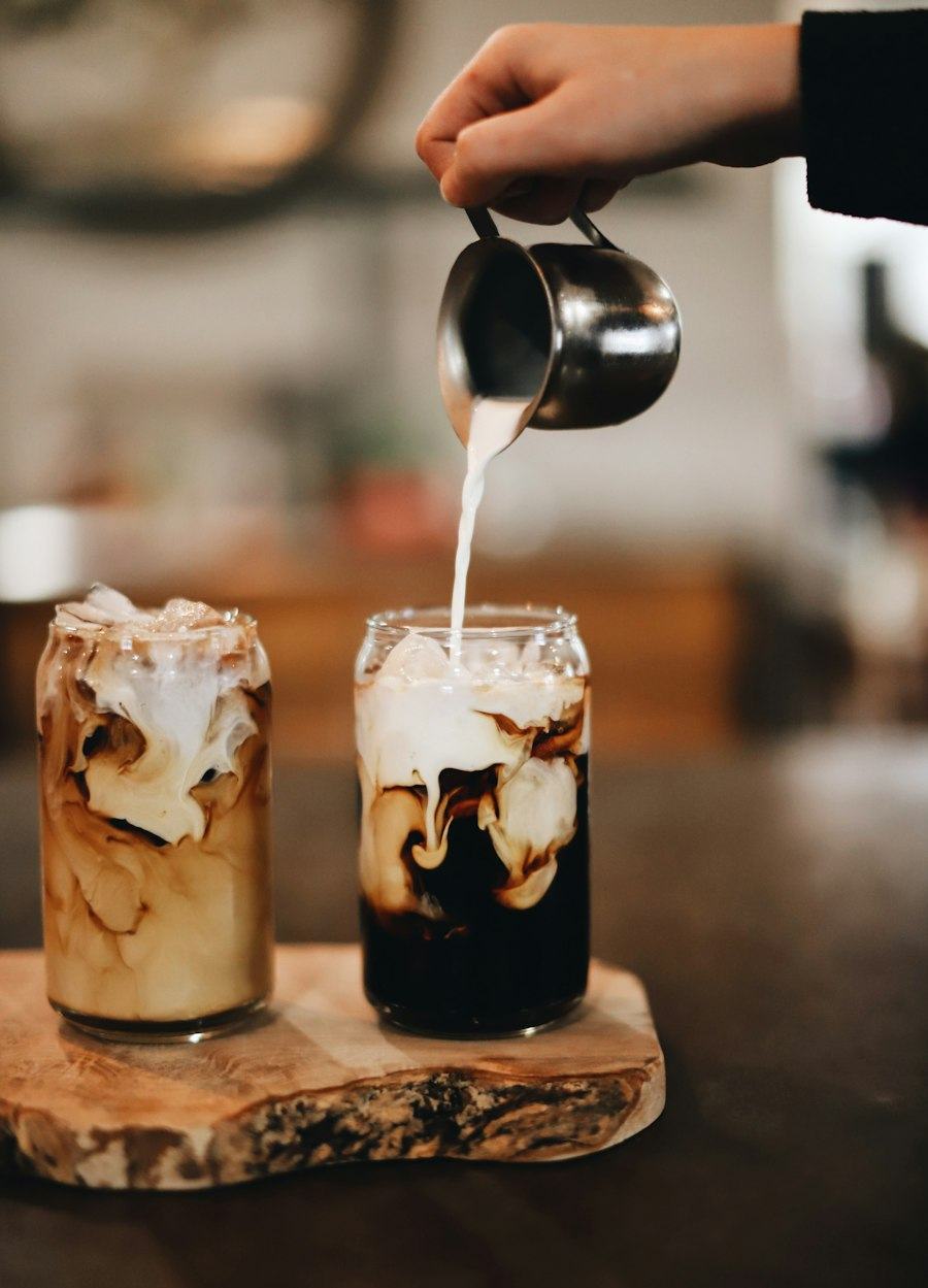 Coconut milk poured into iced coffee