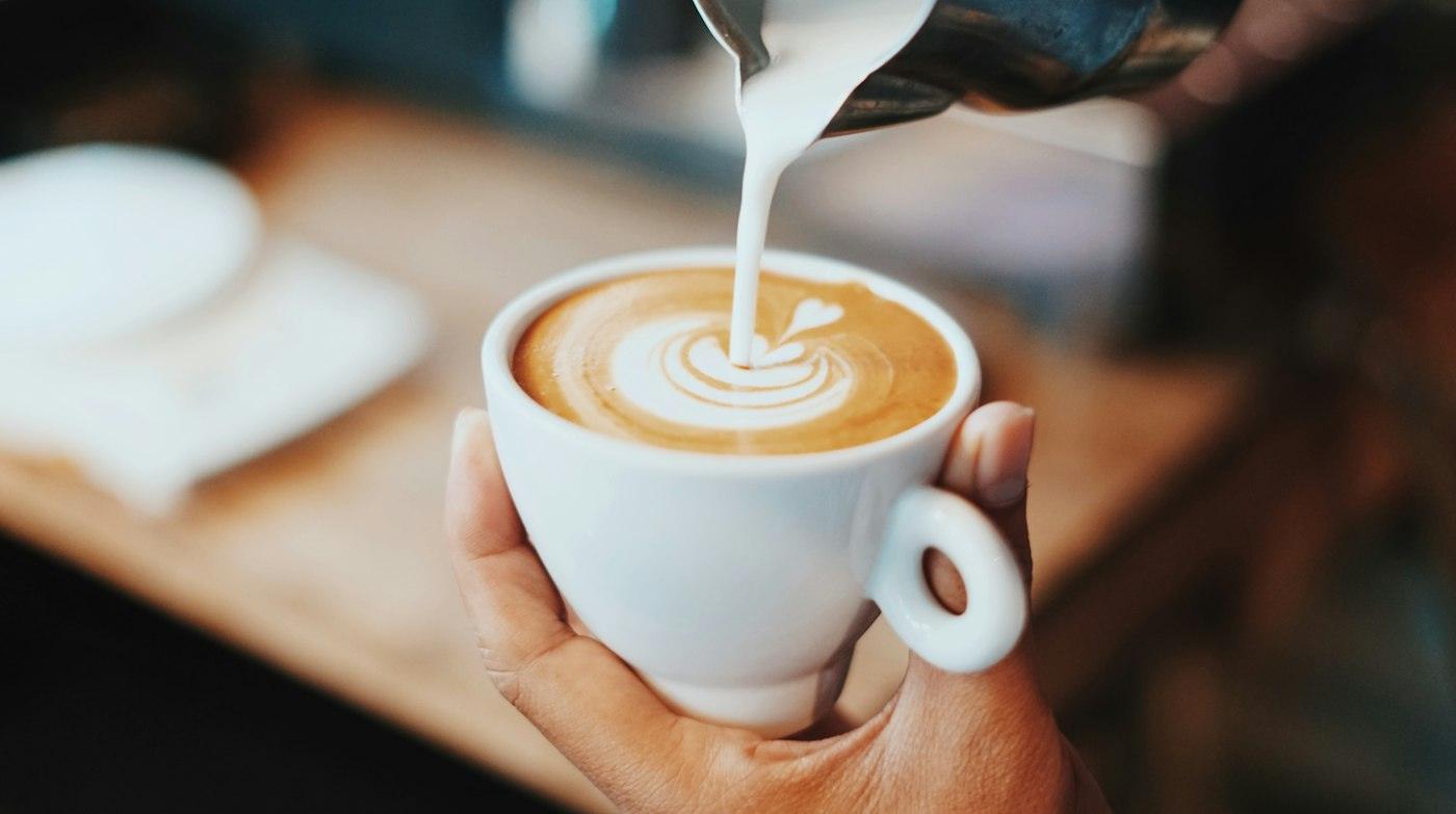 Coconut milk poured into a coffee